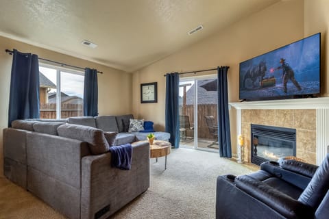 Fireplace, Smart TV, and balcony access for cozy evenings indoors.