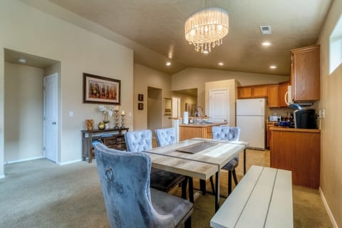 Open dining area flows seamlessly into the kitchen and living room.
