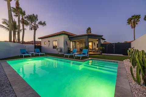 Private pool with a relaxing patio, perfect for refreshing daytime swims and unwinding under the evening ambiance in Aruba