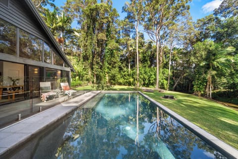 Relax by the heated pool in a tropical setting