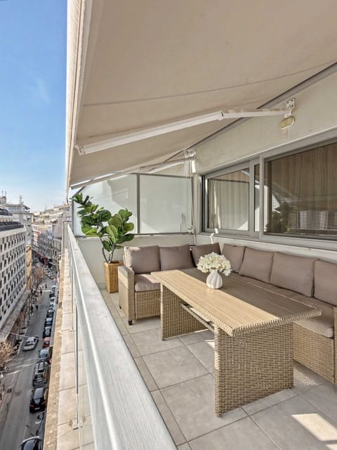 Privat big Balcony with cozy outdoor sofa and awning to protect from sun 
