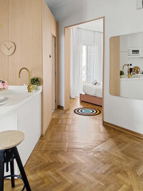 "Welcome home! Step into a bright, beautifully designed space featuring elegant herringbone wooden floors and a warm, sophisticated aesthetic that instantly makes you feel at ease."