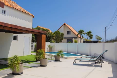 Private pool area with sun loungers; perfect for relaxing.