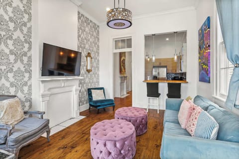Charming living room with plush seating, decorative accents, and a cozy layout ideal for relaxing together.