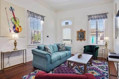 Another view of the living room with plenty of seating and a warm, welcoming feel.