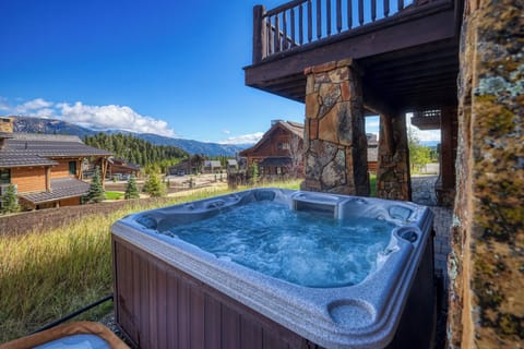 Soak in your private hot tub while gazing at stunning mountain views and alpine chalets in this serene countryside setting.