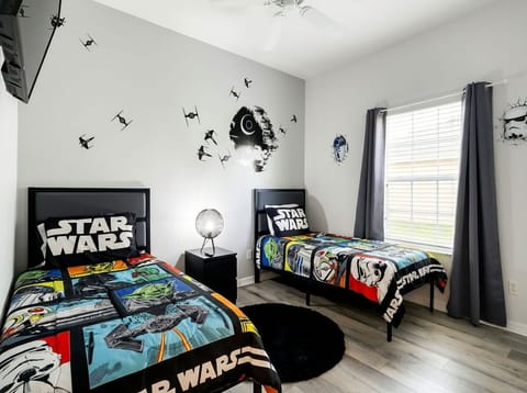 Kids will retreat to the Star Wars themed twin/twin bedroom for a night of comfort. 
