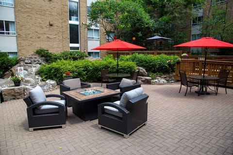 Evening fire pit in the courtyard — the social hour atmosphere carries outdoors on warm nights.