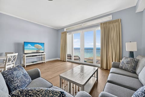 Comfortable living room with queen-size sleeper sofa and beautiful Gulf view.