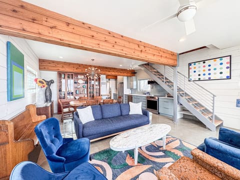 Open-concept living, dining, and kitchen with modern design and stylish furnishings