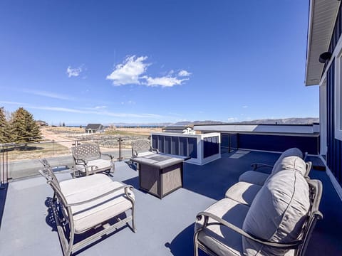 Spacious patio with comfy seating and panoramic mountain and valley views