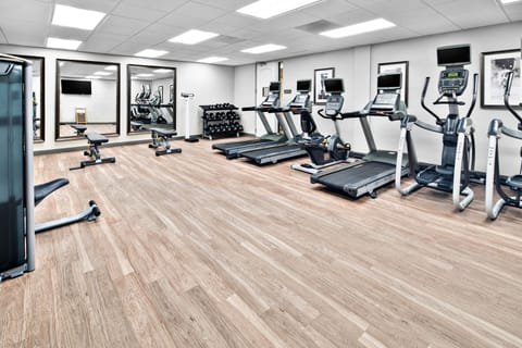 Fully equipped fitness center with cardio and weight machines.