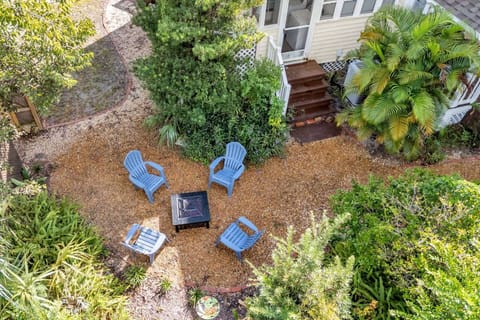 Private backyard seating area with Adirondack chairs and a fire pit—perfect for evening gatherings, conversation, and outdoor relaxation.