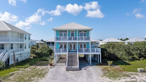 This home stands out from the others with it's light blue exterior