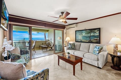 Ocean-view living area with large sliding doors bringing in natural light and island breezes.