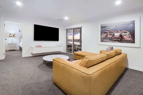 Upstairs TV/lounge area with access to the upstairs balcony overlooking the canal.