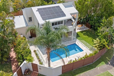 Private tropical pool surrounded by lush coastal gardens