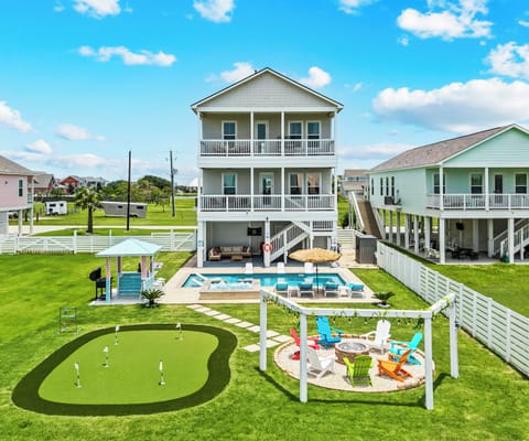 Everything You Need in One Place
From the pool and spa to the gazebo, putting green, fire pit, and outdoor entertainment areas, this drone view highlights the expansive backyard designed for relaxation and fun.