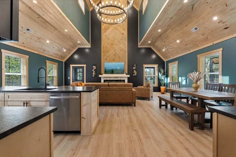 Gorgeous Wooden Cathedral Ceilings with an Open Concept Living Space and Kitchen. 