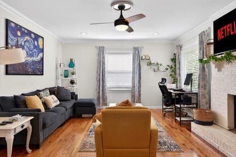 Living Room: Relax in this comfortable living room featuring a TV and cozy seating, perfect for unwinding after a long day.