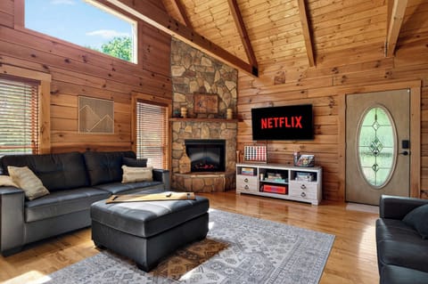 Living Room: Gather around the fireplace after a day on Rough River Lake — this is where the group stories get told.