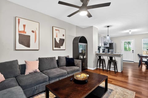 Living Room: Relax in this cozy living room featuring comfortable seating, warm lighting, and a welcoming atmosphere perfect for unwinding after a day of exploring.
