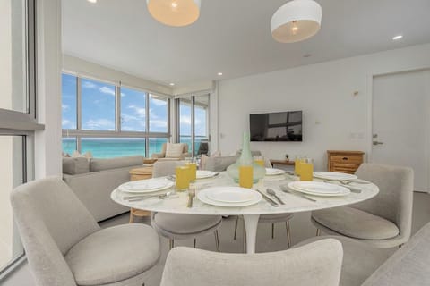 Wake up to breathtaking ocean views from your modern dining area, where morning coffee tastes better with turquoise waters as your backdrop.