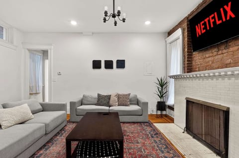 Living Room: Sink into the sectional, flip on the NETFLIX sign, and let movie night officially begin.