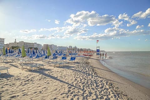 Private beach, white sand, sun loungers, beach umbrellas