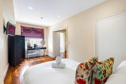 Comfortable bedroom nook featuring tea and coffee facilities and natural daylight