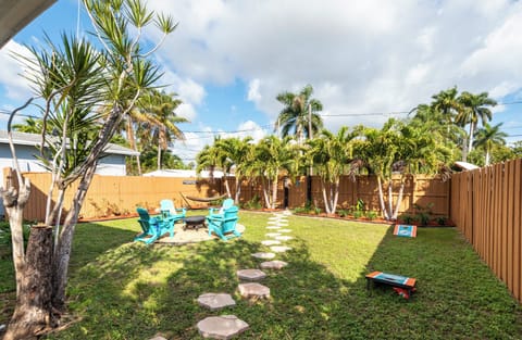 Private fully fenced back yard with fire pit, hammock and grill