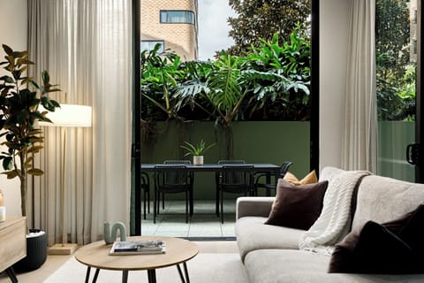 Beautiful living room with comfortable double Ecosa sofa bed. The space flows onto the private courtyard. 