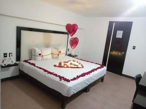 Celebrate a romantic night with petals, candles, and soft light.