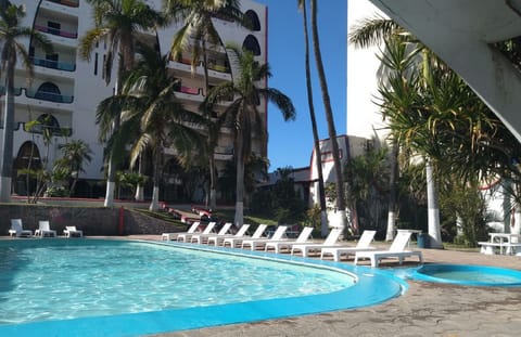 Dive into vacation mode with loungers and shimmering water.