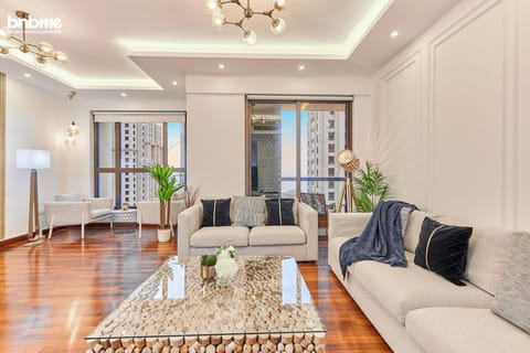 Deluxe Apartment, Partial Sea View | Living area | 55-inch flat-screen TV with cable channels