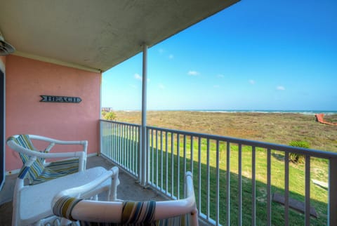 Private balcony with seating overlooking the dunes, offering peaceful Gulf views just steps from the beach.