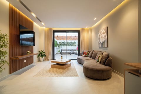 Bright, fully furnished living room with a lovely terrace view