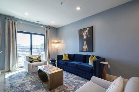 Features elegant, full-length drapes and thoughtfully curated contemporary artwork.