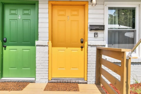 Your stay starts here—Flat No. 3, marked by the bright yellow door so you know you’ve arrived.