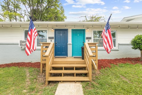 Your stay starts here—Flat No. 6, marked by the bright teal colored door so you know you’ve arrived.