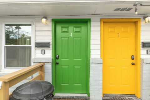 Your stay starts here—Flat No. 4, marked by the bright green door so you know you’ve arrived.