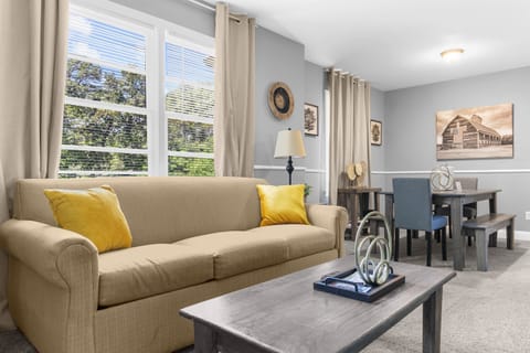 Welcome to Broadmoor Brick Haven - The Upper Bungalow! Open and inviting, the living room flows right into the dining area—so conversations carry on from dinner to downtime.
