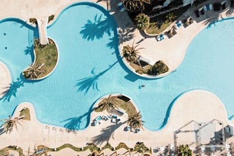Indoor pool, outdoor pool, pool umbrellas, sun loungers