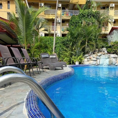 Outdoor pool, open 7:00 AM to 10:00 PM, sun loungers