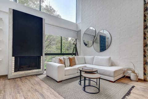 Living room with large windows and plenty of natural light.