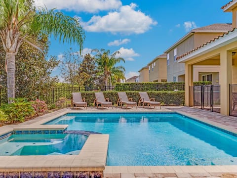 Resort-style pool & spa w/ loungers, perfect for sunny afternoons and refreshing swims