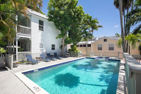 Communal pool and lush tropical landscaping.