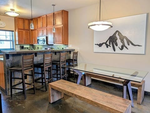 Plenty of seating for everyone at the dining table and breakfast bar