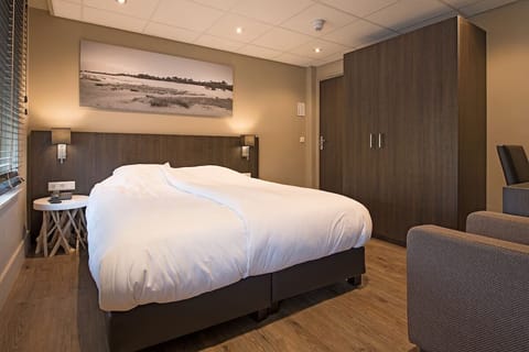 Spread out comfortably with generous wardrobe storage and warm ambient lighting.