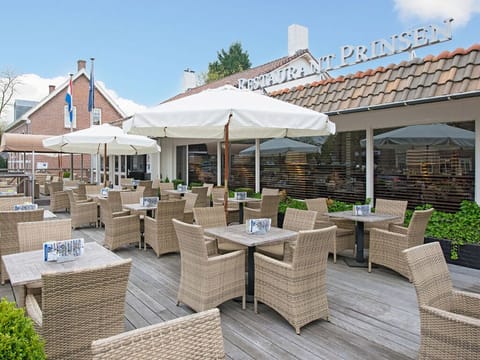 Arrive to a welcoming exterior with an inviting terrace.